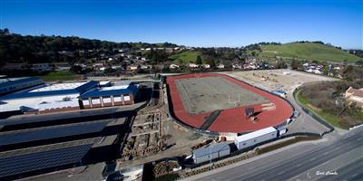 Aerial of the field house building area and football field